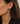 A model wearing heart diamond earrings