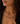 A woman pointed to her custom, ruby and diamond necklace