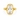 A yellow gold ring featuring a large, cushion-cut clear gemstone in a wavy bezel setting, shown against a plain white background.